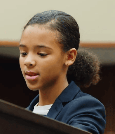 Student 2 Young African-American woman speaking during mock trial.